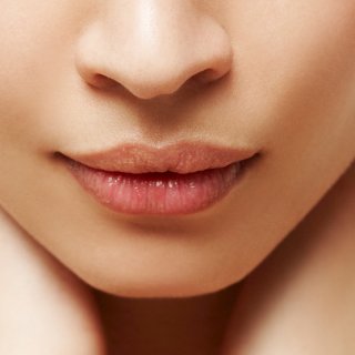 Weibliche Lippen, mit Lipgloss geschminkt